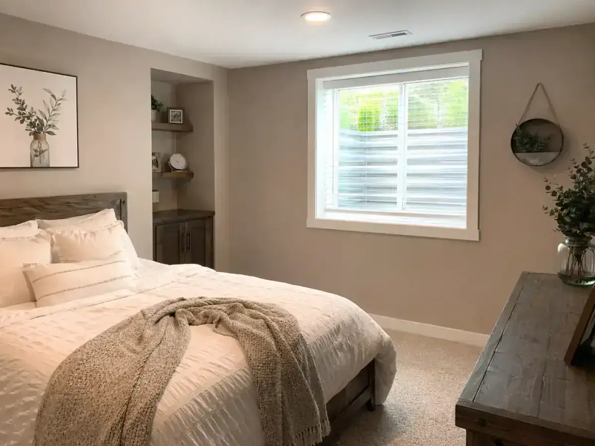 Basement living space with egress window installation finished to match existing Iowa home interiors